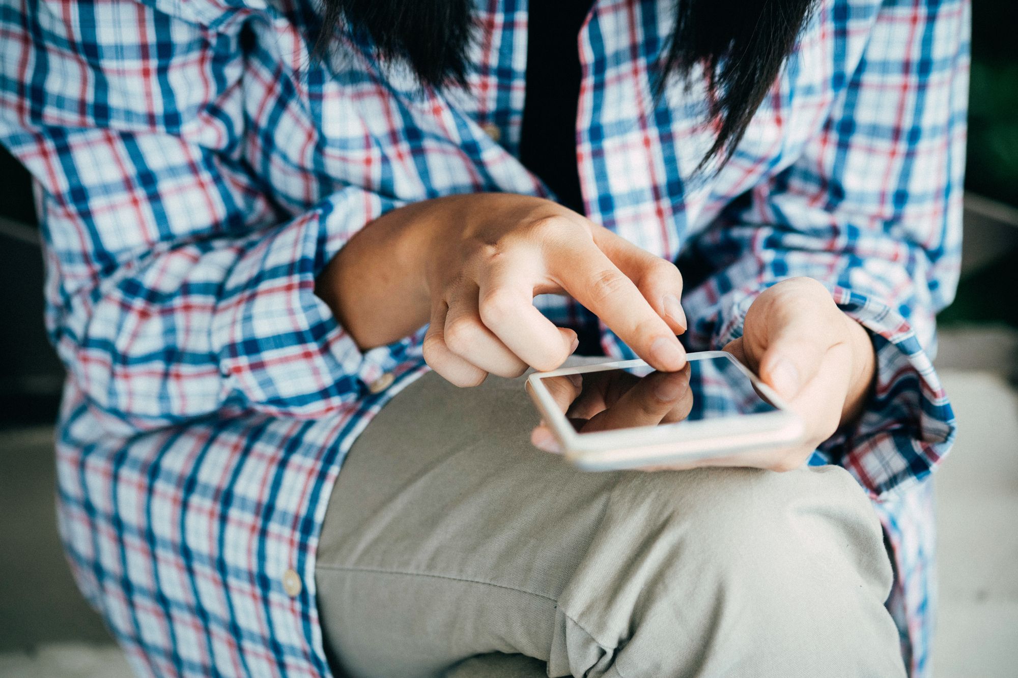 A woman checking her smartphone